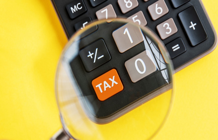 Magnifying Glass and Tax on Calculator